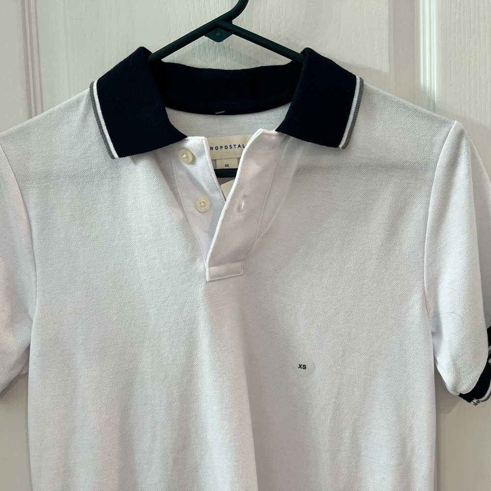 Aeropostale White Polo with Black Collar PTP 16 inches. Labeled xs